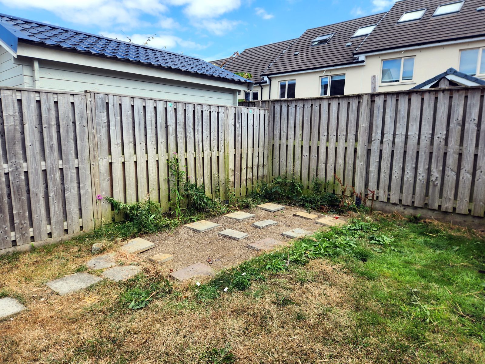 The same back garden with the shed removed